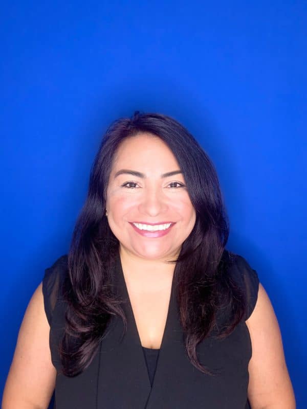 a woman smiling for the camera